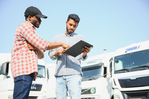 [freepicdownloader.com]-logistics-manager-controlling-truck-driver-schedule-normal
